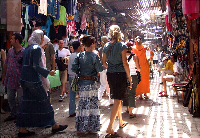 Tourists walking in Rabat's old-medina Souk. Image from archive.