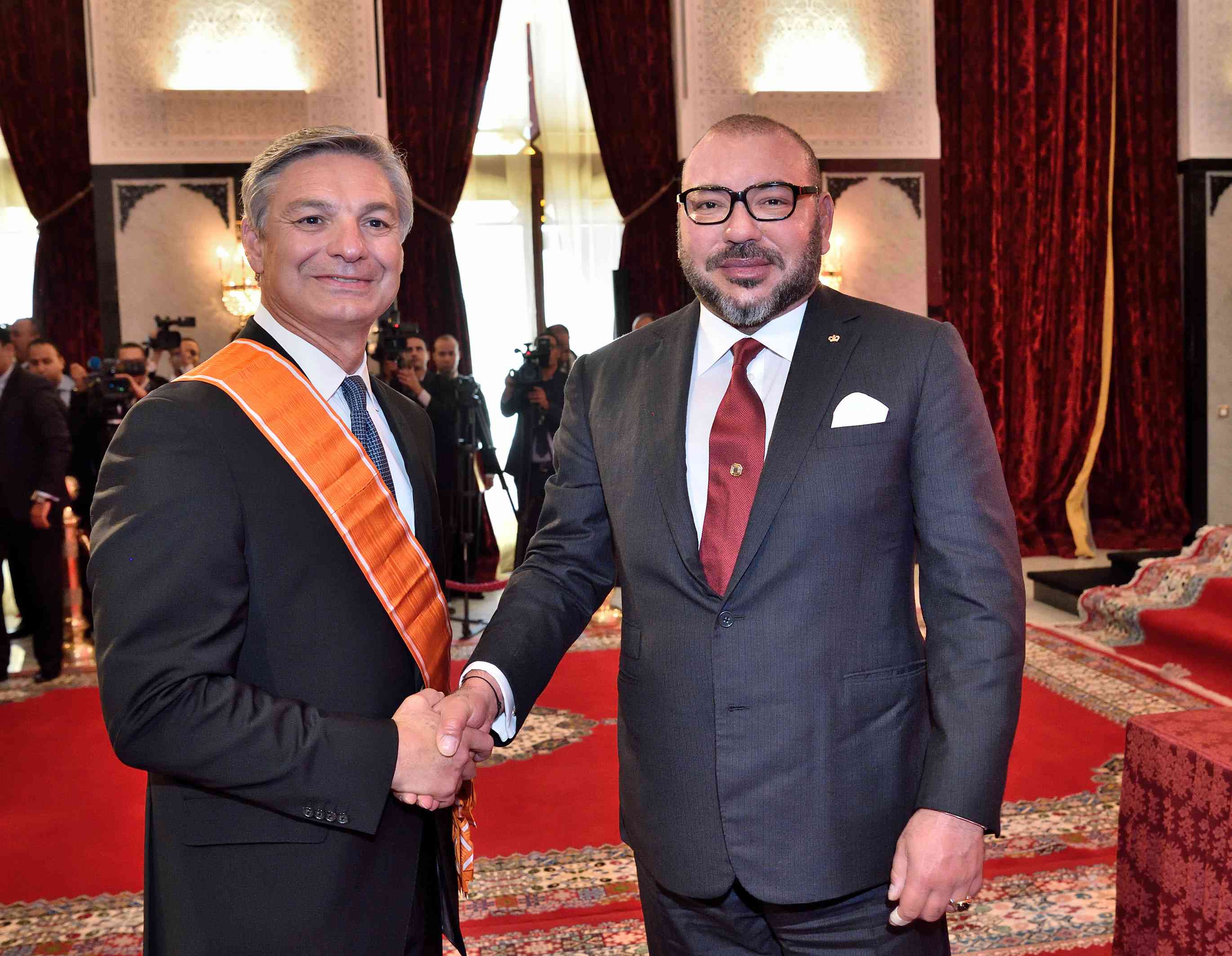 Morocco's King Mohammed VI (right) shakes hands with Raymond L. Conner, Vice Chairman of The Boeing Company and President and Chief Executive Officer of Boeing Commercial Airplanes, at a ceremony in Tangier, Morocco held September 27, 2016.