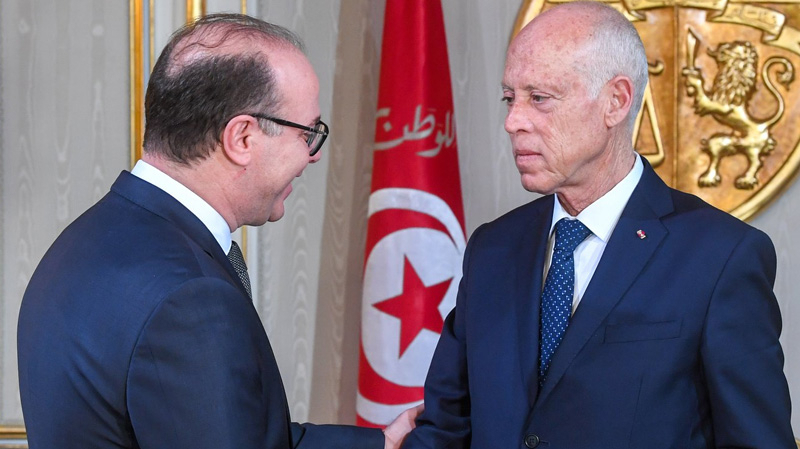 Tunisian president Kais Said greeting Prime Minister Elyes Fakhfakh.